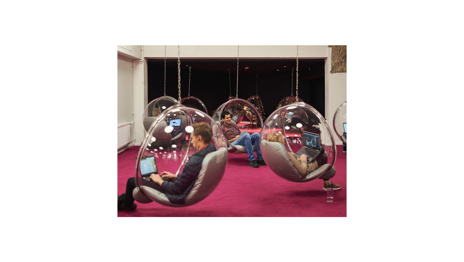 Students sitting in bubble chairs
